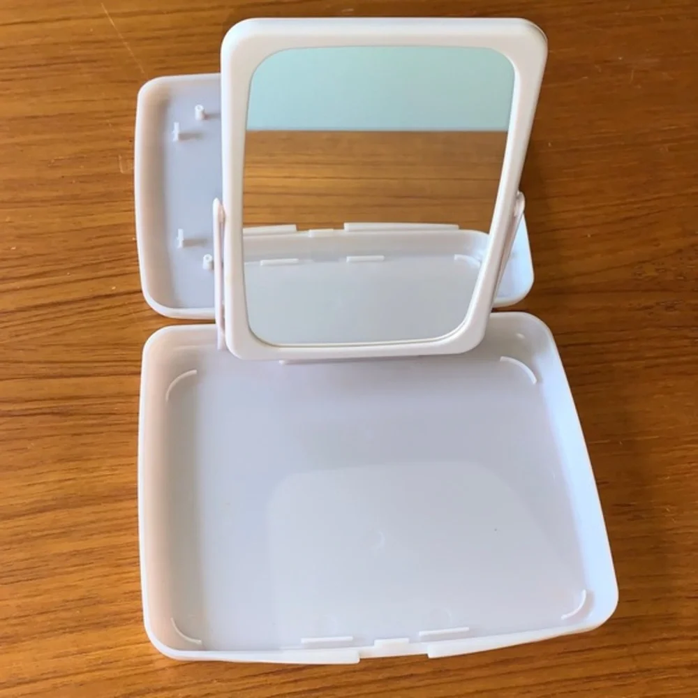 Mary Kay pink plastic compact travel mirror.
